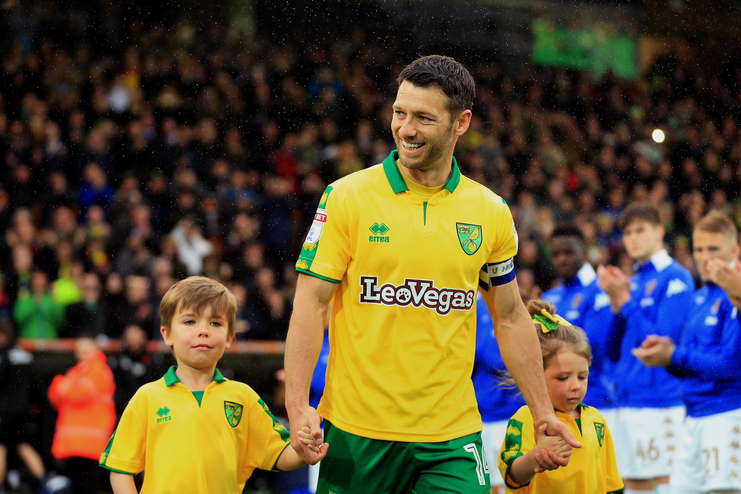 NORWICH, ENGLAND - APRIL 28: Wes Hoolahan of Norwich City walks out with his children to a guard of honour as he makes his last appearance for the club during the Sky Bet Championship match between Norwich City and Leeds United at Carrow Road on April 28 NORWICH, ENGLAND - APRIL 28: Wes Hoolahan of Norwich City walks out with his children to a guard of honour as he makes his last appearance for the club during the Sky Bet Championship match between Norwich City and Leeds United at Carrow Road on April 28