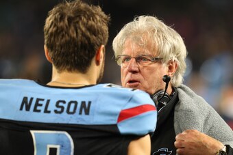 ARLINGTON, TEXAS - FEBRUARY 09:  Offensive coordinator Hal Mumme of the Dallas Renegades talks to Philip Nelson #9 on the sidelines at an XFL Game against the St. Louis Battlehawks on February 09, 2020 in Arlington, Texas. (Photo by Richard Rodriguez/Gett