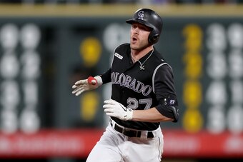 DENVER, COLORADO - SEPTEMBER 28: Trevor Story #27 of the Colorado Rockies circles the bases after hitting a walk off home in the tenth inning against the Milwaukee Brewers at Coors Field on September 28, 2019 in Denver, Colorado. (Photo by Matthew Stockma