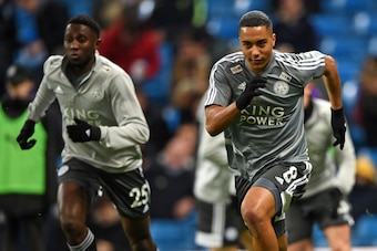 Leicester City's Nigerian midfielder Wilfred Ndidi (L) and Leicester City's Belgian midfielder Youri Tielemans (R)  warm up ahead of the English Premier League football match between Manchester City and Leicester City at the Etihad Stadium in Manchester, 
