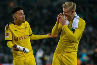 Dortmund's Norwegian forward Erling Braut Haaland and Dortmund's English midfielder Jadon Sancho react after the German first division Bundesliga football match Borussia Moenchengladbach v Borussia Dortmund in Moenchengladbach, western Germany on March 7,