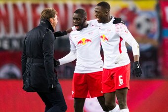 Leipzig's Austrian head coach Ralph Hasenhuettl (L), Leipzig's French defender Dayot Upamecano  (C) and Leipzig's French defender Ibrahima Konate celebrate after winning the German first division Bundesliga football match between RB Leipzig and FC Bayern 