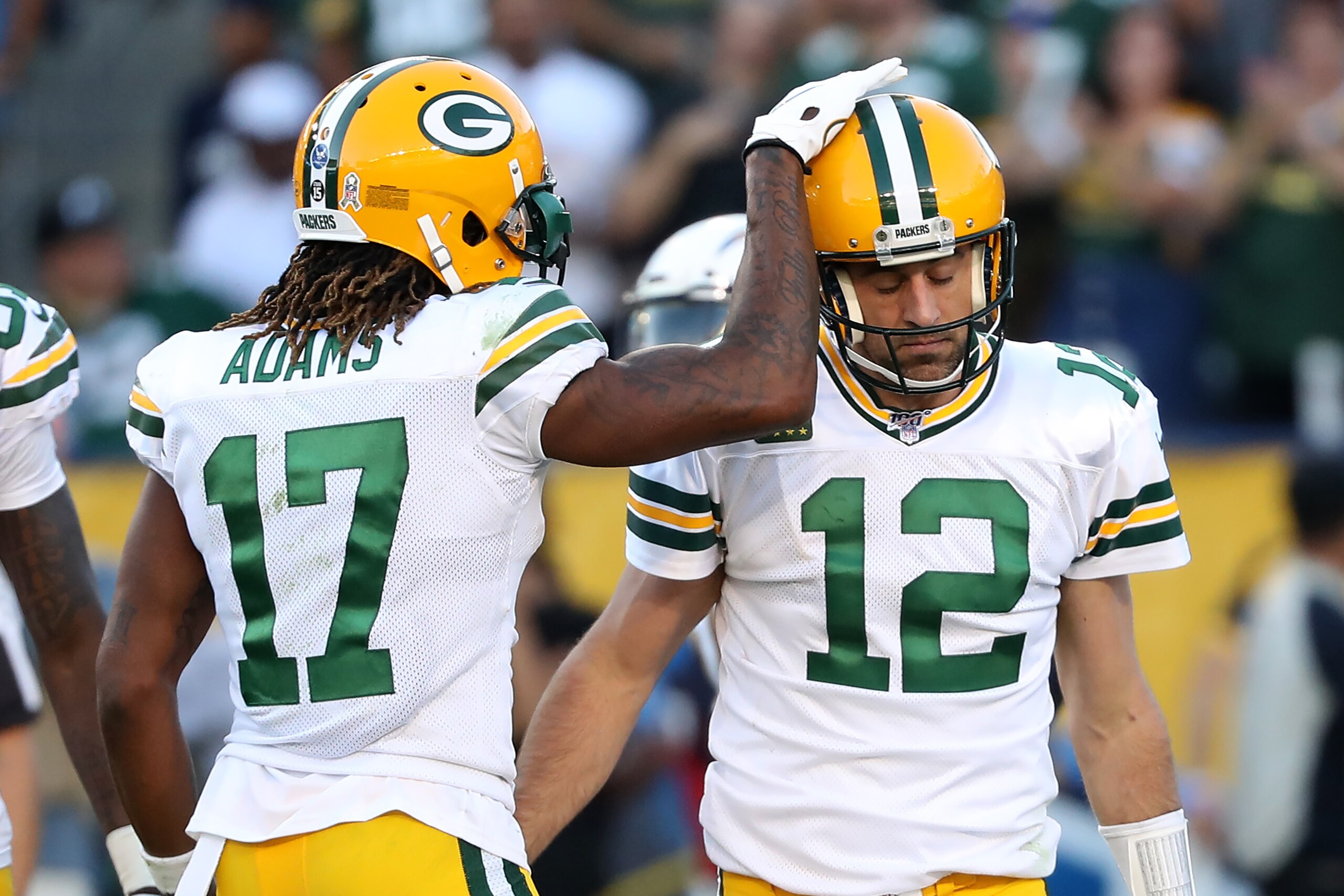 CARSON, CALIFORNIA - NOVEMBER 03:  Davante Adams #17 congratulates Aaron Rodgers #12 of the Green Bay Packers after scoring a two-point conversion during the second half of a game against the Los Angeles Chargers at Dignity Health Sports Park on November 