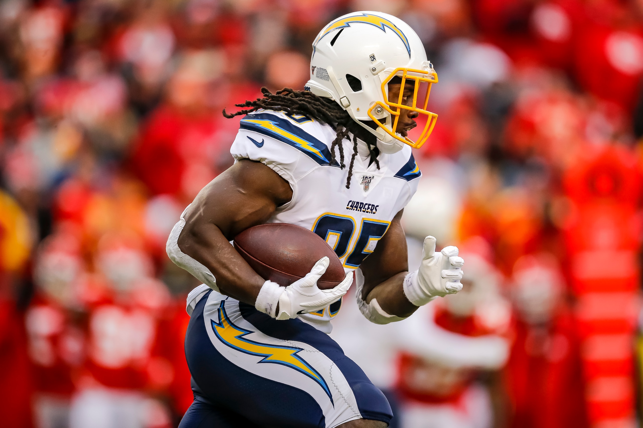 KANSAS CITY, MO - DECEMBER 29: Melvin Gordon #25 of the Los Angeles Chargers runs with the football during the second quarter against the Kansas City Chiefs at Arrowhead Stadium on December 29, 2019 in Kansas City, Missouri. (Photo by David Eulitt/Getty I