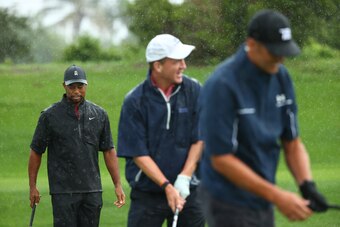 HOBE SOUND, FLORIDA - MAY 24: Tiger Woods. former NFL player Peyton Manning and NFL player Tom Brady of the Tampa Bay Buccaneers warm up on the range prior to The Match: Champions For Charity at Medalist Golf Club on May 24, 2020 in Hobe Sound, Florida. (