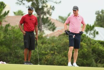 HOBE SOUND, FLORIDA - MAY 24: Tiger Woods and former NFL player Peyton Manning look on from the fourth green during The Match: Champions For Charity at Medalist Golf Club on May 24, 2020 in Hobe Sound, Florida. (Photo by Mike Ehrmann/Getty Images for The 