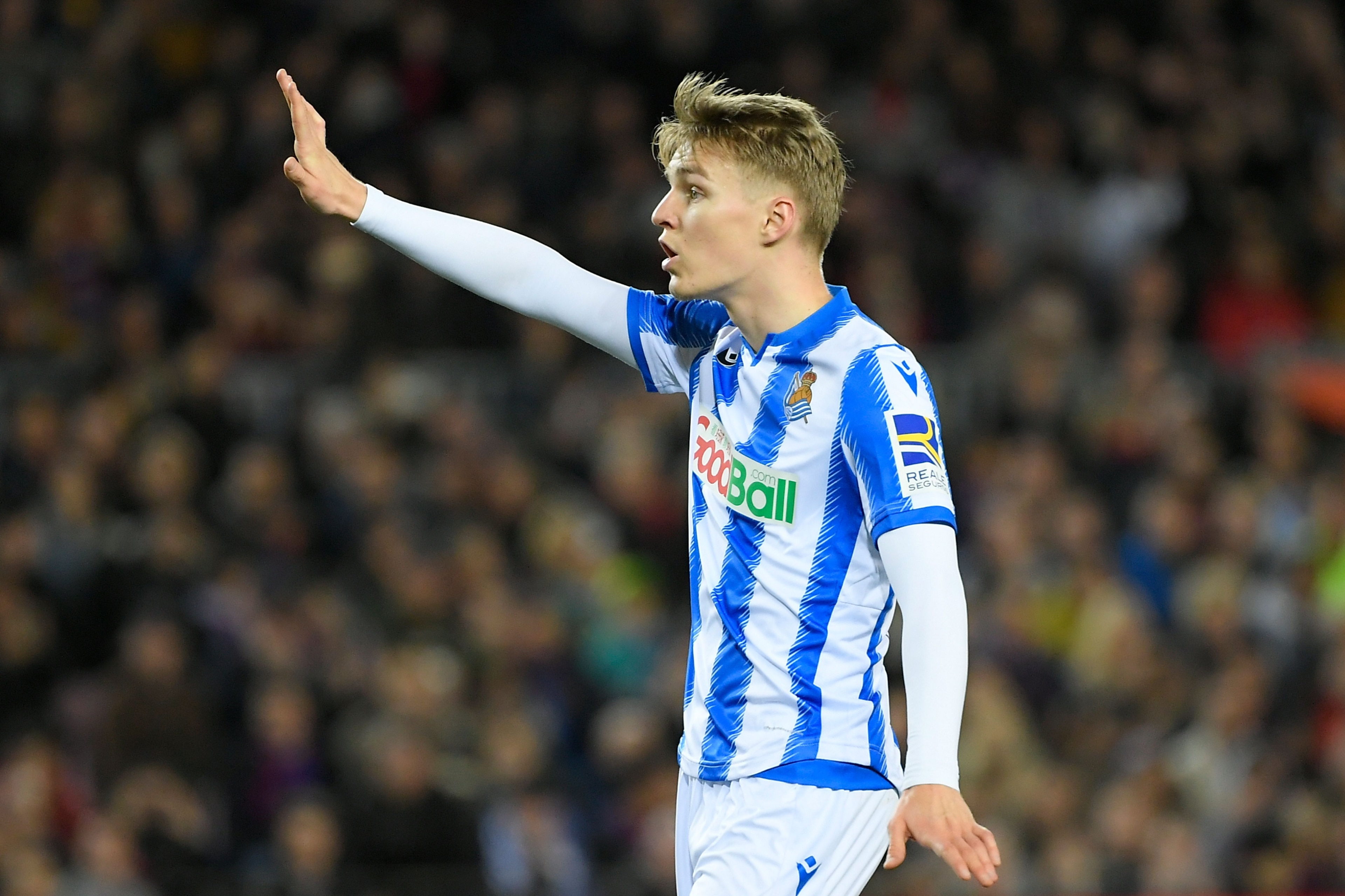 Real Sociedad's Norwegian midfielder Martin Odegaard gestures during the Spanish league football match between FC Barcelona and Real Sociedad at the Camp Nou stadium in Barcelona on March 7, 2020. (Photo by LLUIS GENE / AFP) (Photo by LLUIS GENE/AFP via G Real Sociedad's Norwegian midfielder Martin Odegaard gestures during the Spanish league football match between FC Barcelona and Real Sociedad at the Camp Nou stadium in Barcelona on March 7, 2020. (Photo by LLUIS GENE / AFP) (Photo by LLUIS GENE/AFP via G