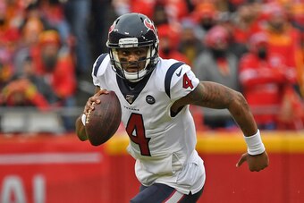 KANSAS CITY, MISSOURI - JANUARY 12: Quarterback Deshaun Watson #4 of the Houston Texans rolls out in the second half during the AFC Divisional playoff game against the Kansas City Chiefs at Arrowhead Stadium on January 12, 2020 in Kansas City, Missouri. (