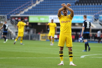 Dortmund's Moroccan defender Achraf Hakimi celebrates after scoring his team's fourth goal during the German first division Bundesliga football match SC Paderborn 07 and Borussia Dortmund at Benteler Arena in Paderborn on May 31, 2020. (Photo by Lars Baro