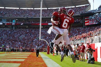 TUSCALOOSA, ALABAMA - SEPTEMBER 28:  DeVonta Smith #6 of the Alabama Crimson Tide reacts after scoring a touchdown against the Mississippi Rebels with Jaylen Waddle #17 at Bryant-Denny Stadium on September 28, 2019 in Tuscaloosa, Alabama. (Photo by Kevin 