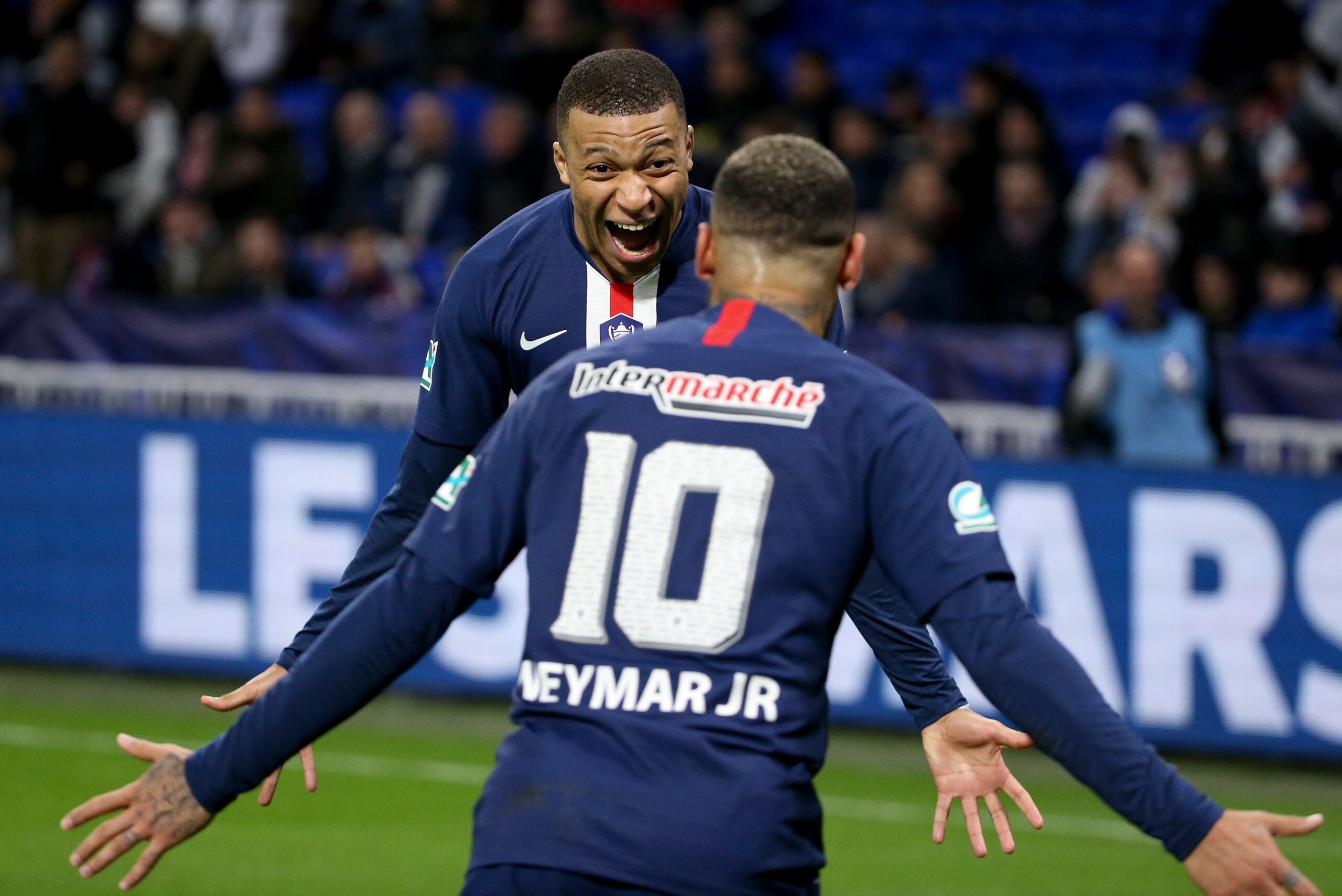 LYON, FRANCE - MARCH 4: Kylian Mbappe of PSG celebrates his third goal with Neymar Jr during the French Cup semifinal match between Olympique Lyonnais (OL) and Paris Saint-Germain (PSG) at Groupama Stadium on March 4, 2020 in Decines near Lyon, France. (P