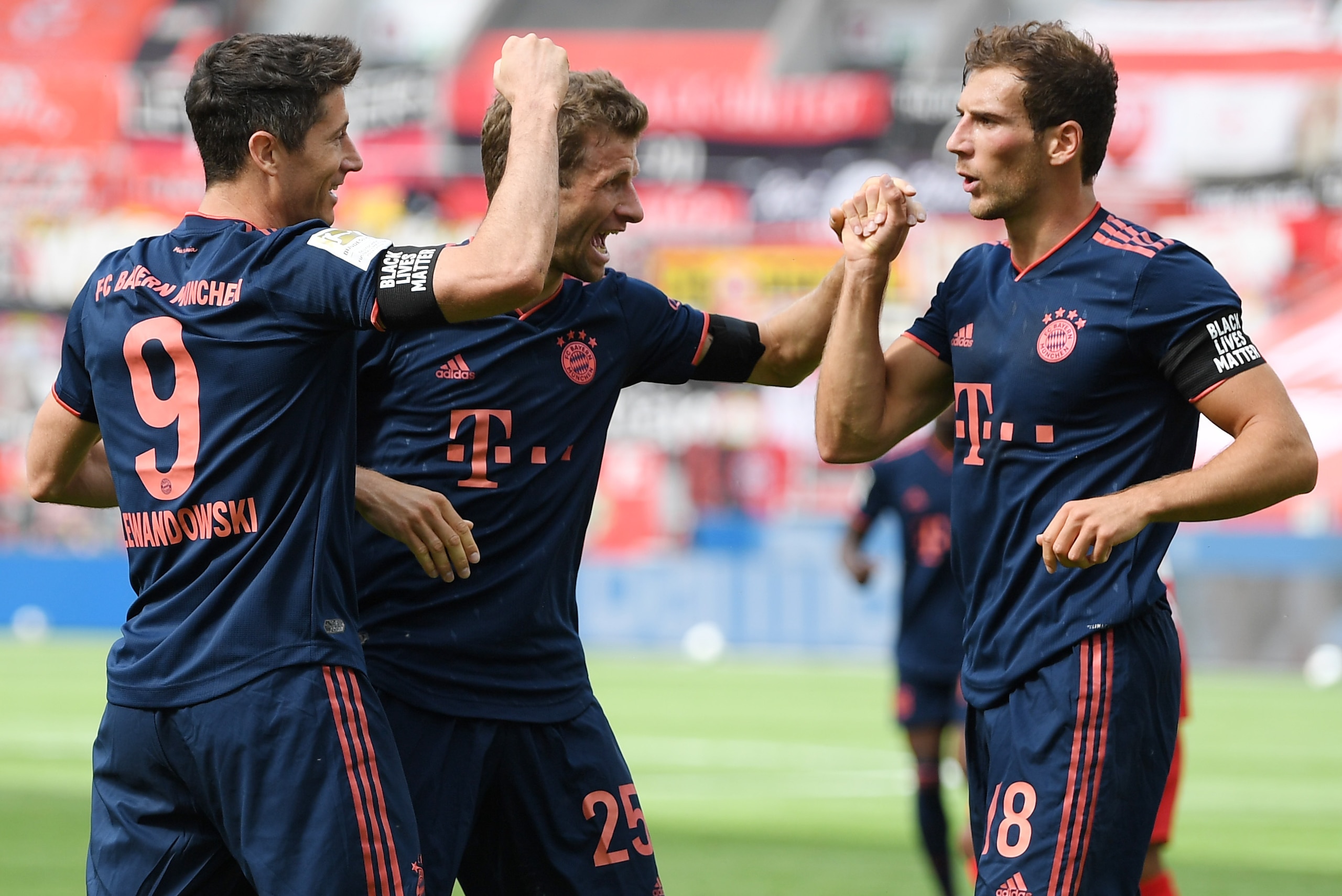 LEVERKUSEN, GERMANY - JUNE 06: Robert Lewandowski of Muenchen celebrates his team's fourth goal with teammates Thomas Mueller and Leon Goretzka (L-R) during the Bundesliga match between Bayer 04 Leverkusen and FC Bayern Muenchen at BayArena on June 06, 20