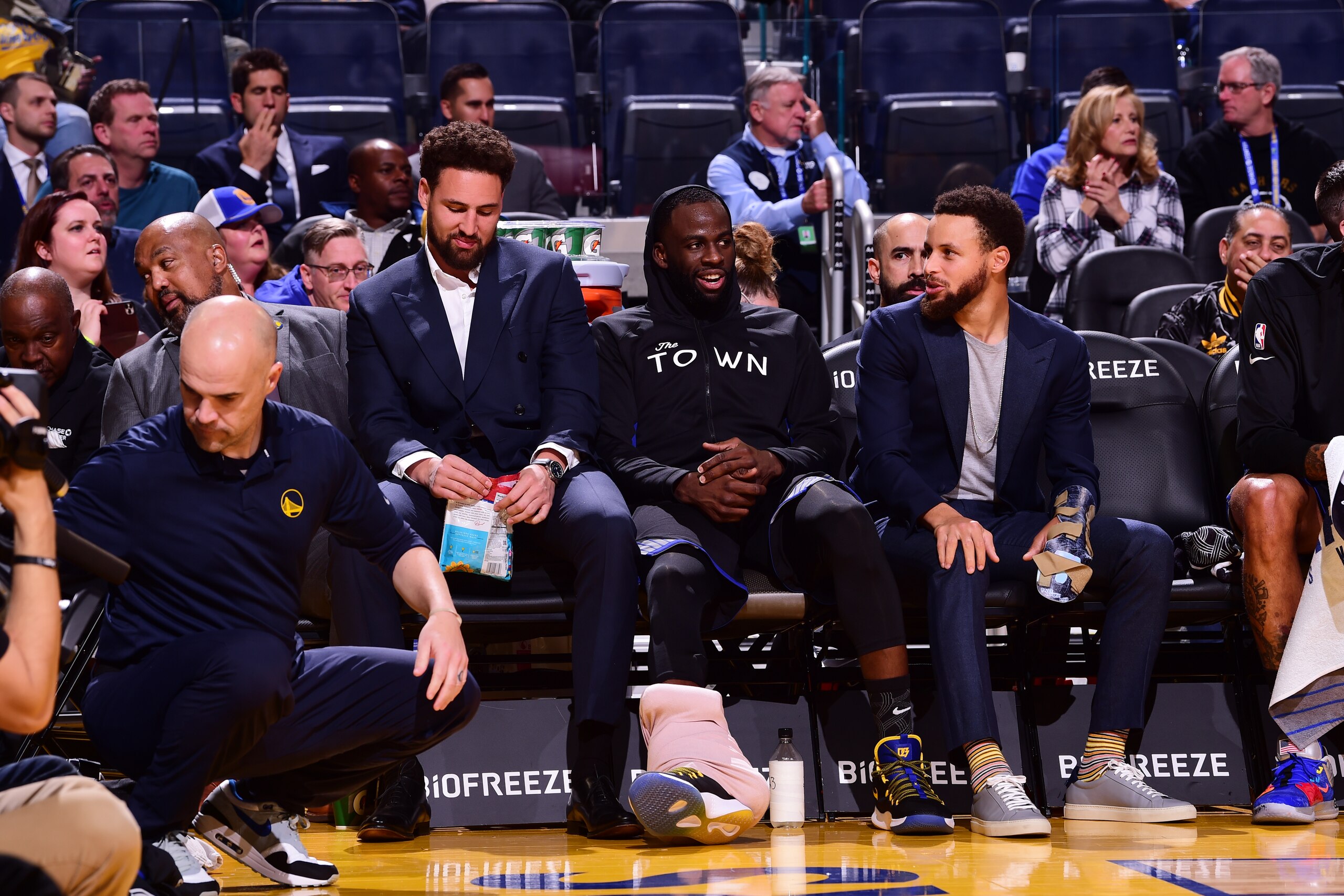 SAN FRANCISCO, CA - NOVEMBER 27: Klay Thompson #11, Draymond Green #23, and Stephen Curry #30 of the Golden State Warriors smile during a game against the Chicago Bulls on November 27, 2019 at Chase Center in San Francisco, California. NOTE TO USER: User 