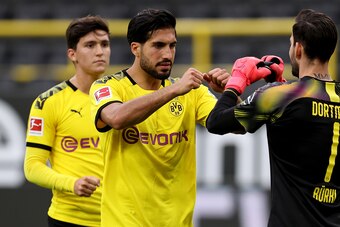 Dortmund's German midfielder Emre Can (C) celebrates after the German first division Bundesliga football match BVB Borussia Dortmund v Hertha Berlin on June 6, 2020 in Dortmund, western Germany. (Photo by Lars Baron / POOL / AFP) / DFL REGULATIONS PROHIBI
