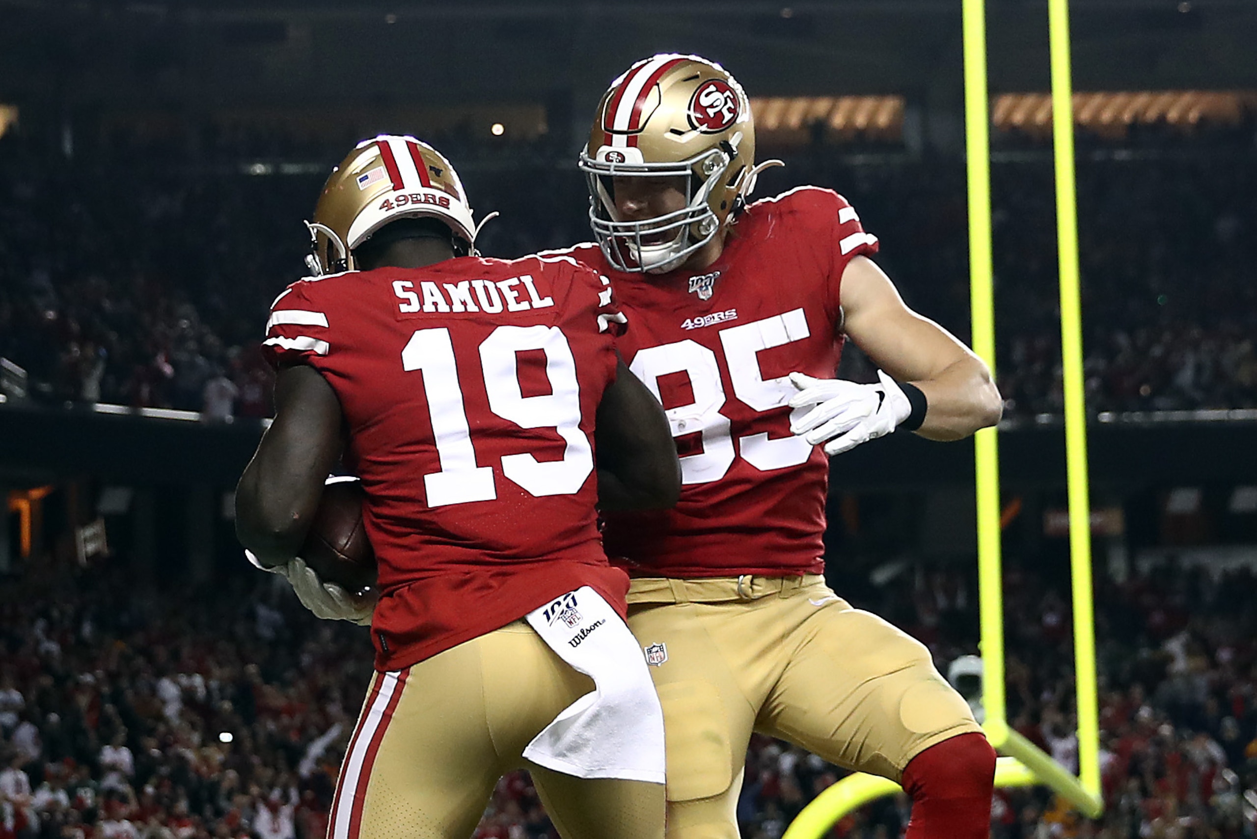 SANTA CLARA, CALIFORNIA - NOVEMBER 24:  Wide receiver Deebo Samuel #19 of the San Francisco 49ers is congratulated by tight end George Kittle #85 after a touchdown during the first half of the game against the Green Bay Packers at Levi's Stadium on Novemb