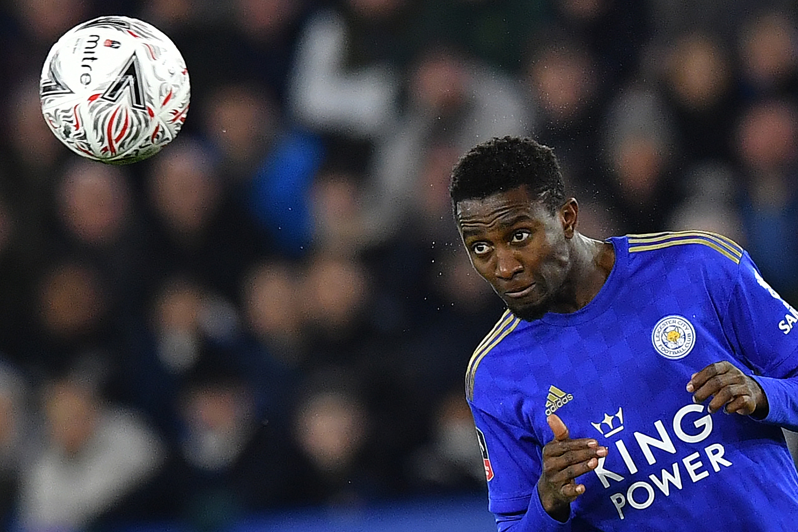 Leicester City's Nigerian midfielder Wilfred Ndidi headers the ball during the English FA Cup fifth round football match between Leicester City and Birmingham City at King Power Stadium in Leicester, central England on March 4, 2020. (Photo by Ben STANSAL