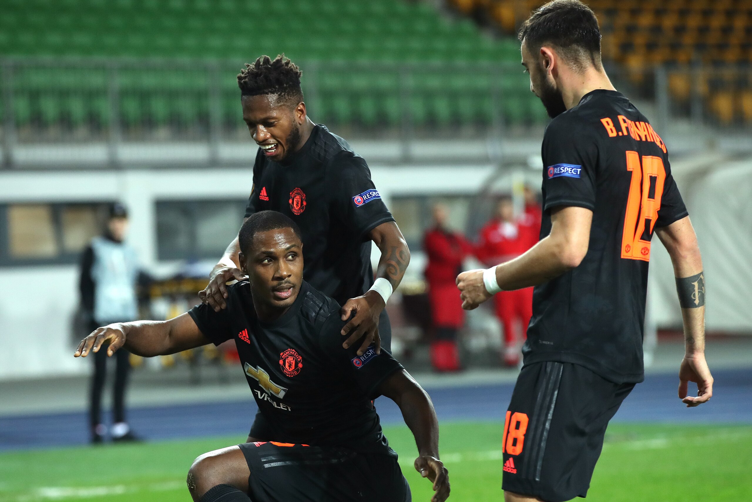 LINZ, AUSTRIA - MARCH 12: (FREE FOR EDITORIAL USE) In this handout image provided by UEFA, Odion Ighalo of Manchester United celebrates with Fred and Bruno Fernandes after scoring his team's first goal during the UEFA Europa League round of 16 first leg m