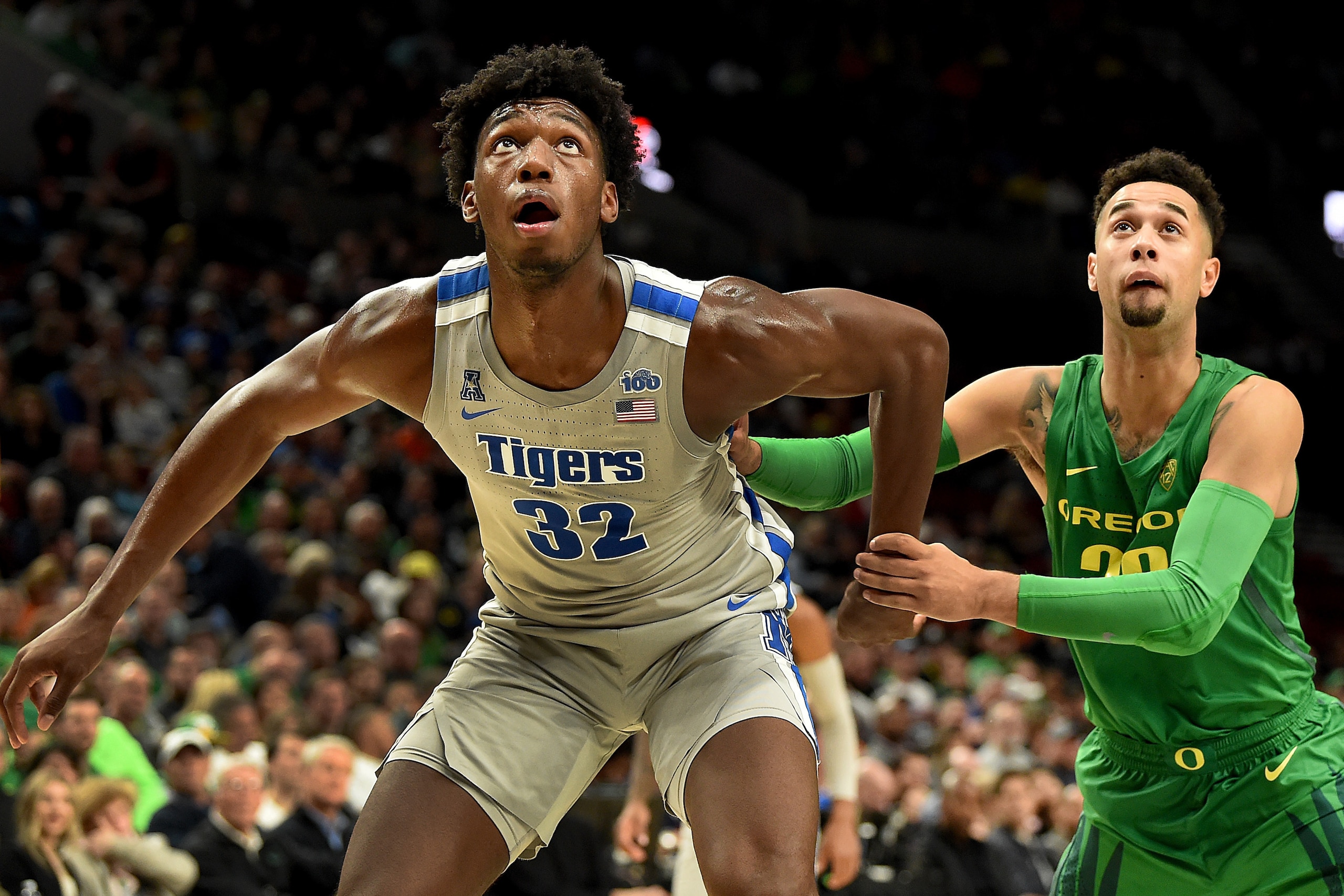 PORTLAND, OREGON - NOVEMBER 12: James Wiseman #32 of the Memphis Tigers and Anthony Mathis #32 of the Oregon Ducks battle for position during the second half of the game at Moda Center on November 12, 2019 in Portland, Oregon. Oregon won the game 82-74.  