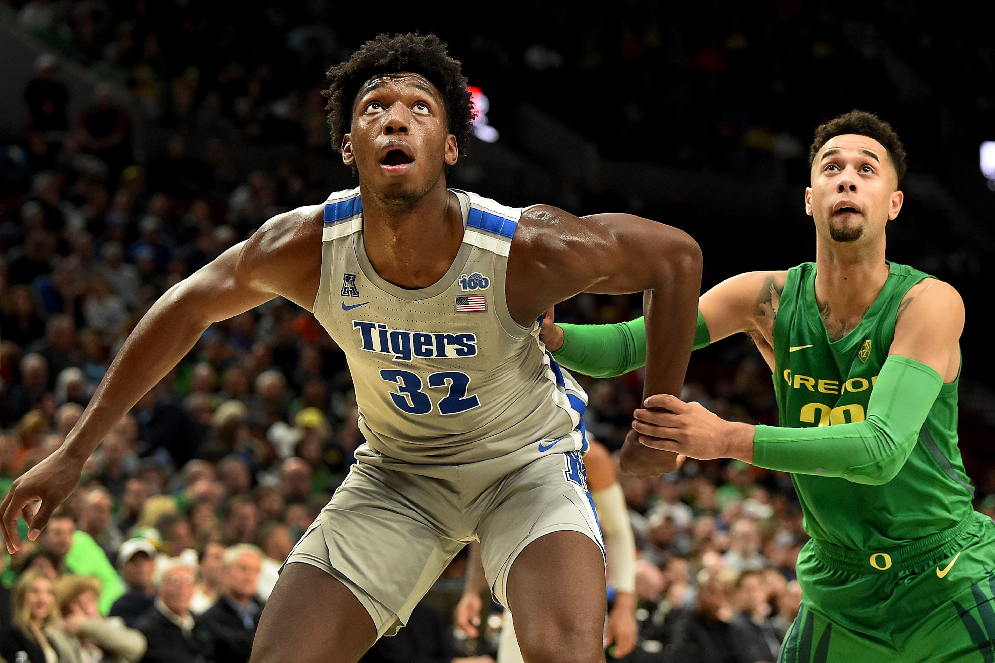 PORTLAND, OREGON - NOVEMBER 12: James Wiseman #32 of the Memphis Tigers and Anthony Mathis #32 of the Oregon Ducks battle for position during the second half of the game at Moda Center on November 12, 2019 in Portland, Oregon. Oregon won the game 82-74.  