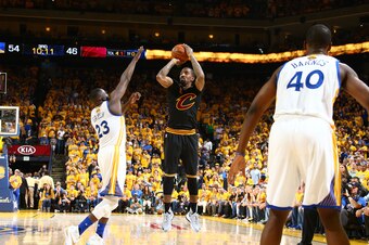 OAKLAND, CA - JUNE 19:  J.R. Smith #5 of the Cleveland Cavaliers shoots against Draymond Green #23 of the Golden State Warriors in Game Seven of the 2016 NBA Finals on June 19, 2016 at Oracle Arena in Oakland, California. NOTE TO USER: User expressly ackn