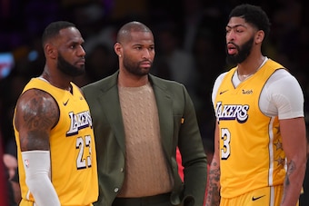 LOS ANGELES, CA - DECEMBER 25:  LeBron James #23 and Anthony Davis #3 talk with DeMarcus Cousins #15 of the Los Angeles Lakers on the bench during a time out in the game against the Los Angeles Clippers at Staples Center on December 25, 2019 in Los Angele