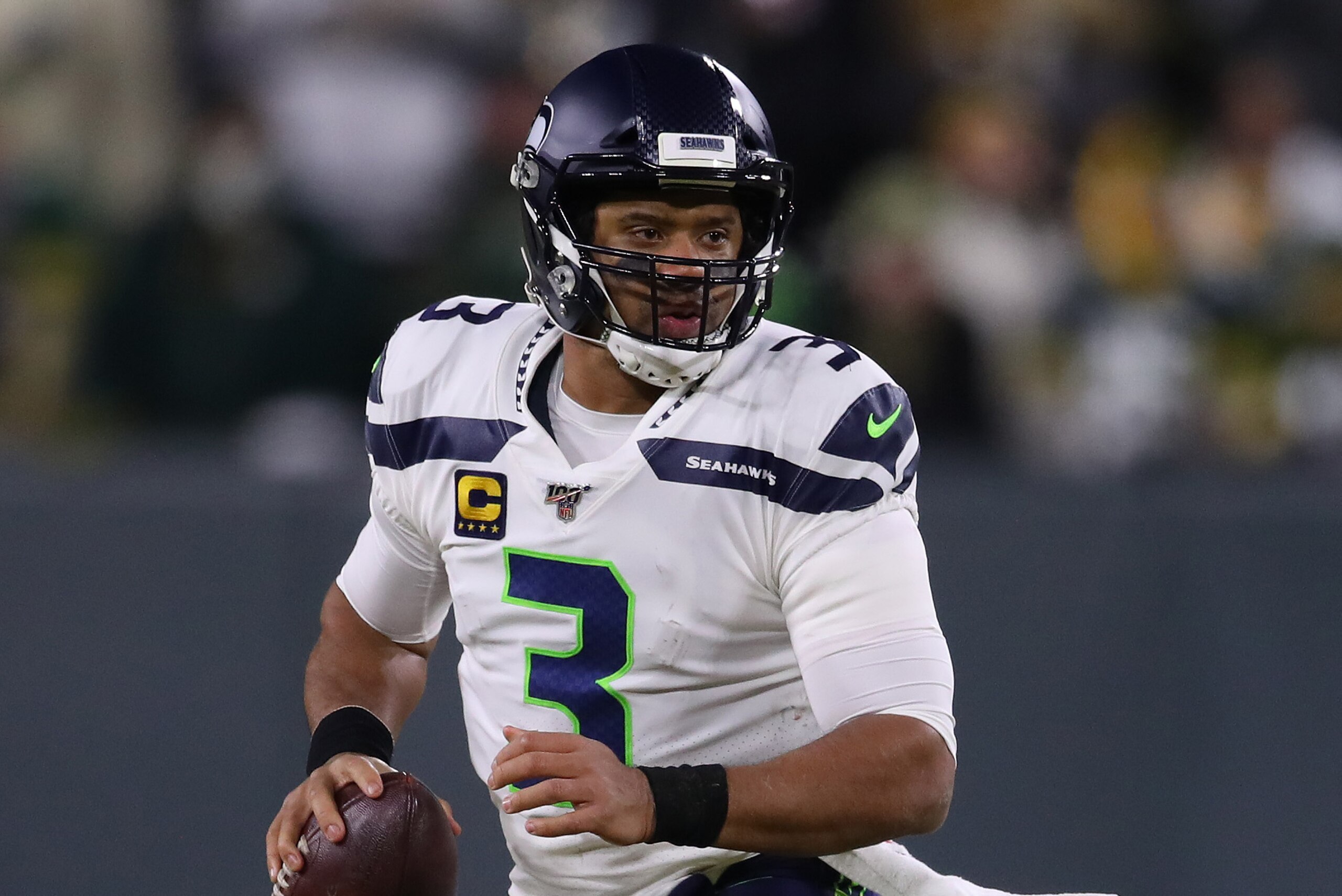 GREEN BAY, WISCONSIN - JANUARY 12: Russell Wilson #3 of the Seattle Seahawks plays against the Green Bay Packers during the NFC divisional round of the playoffs at Lambeau Field on January 12, 2020 in Green Bay, Wisconsin. (Photo by Gregory Shamus/Getty I