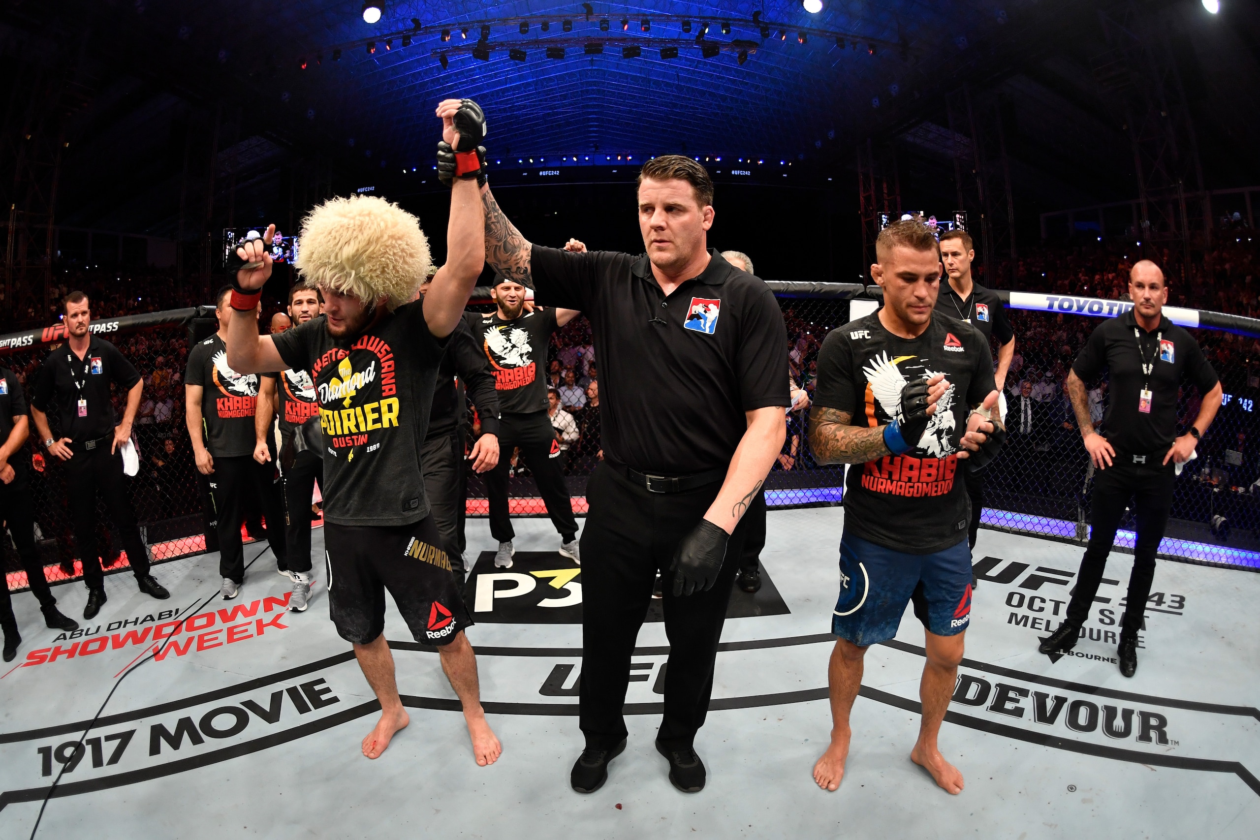 ABU DHABI, UNITED ARAB EMIRATES - SEPTEMBER 07: (L-R) Khabib Nurmagomedov of Russia celebrates his submission victory over Dustin Poirier in their lightweight championship bout during UFC 242 at The Arena on September 7, 2019 in Yas Island, Abu Dhabi, Un ABU DHABI, UNITED ARAB EMIRATES - SEPTEMBER 07: (L-R) Khabib Nurmagomedov of Russia celebrates his submission victory over Dustin Poirier in their lightweight championship bout during UFC 242 at The Arena on September 7, 2019 in Yas Island, Abu Dhabi, Un