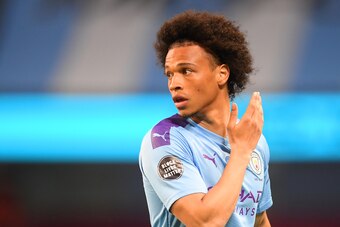 MANCHESTER, ENGLAND - JUNE 22: Leroy Sane of Manchester City looks on while showing the Black Lives Matter movement logo on his shirt sleeve during the Premier League match between Manchester City and Burnley FC at Etihad Stadium on June 22, 2020 in Manch