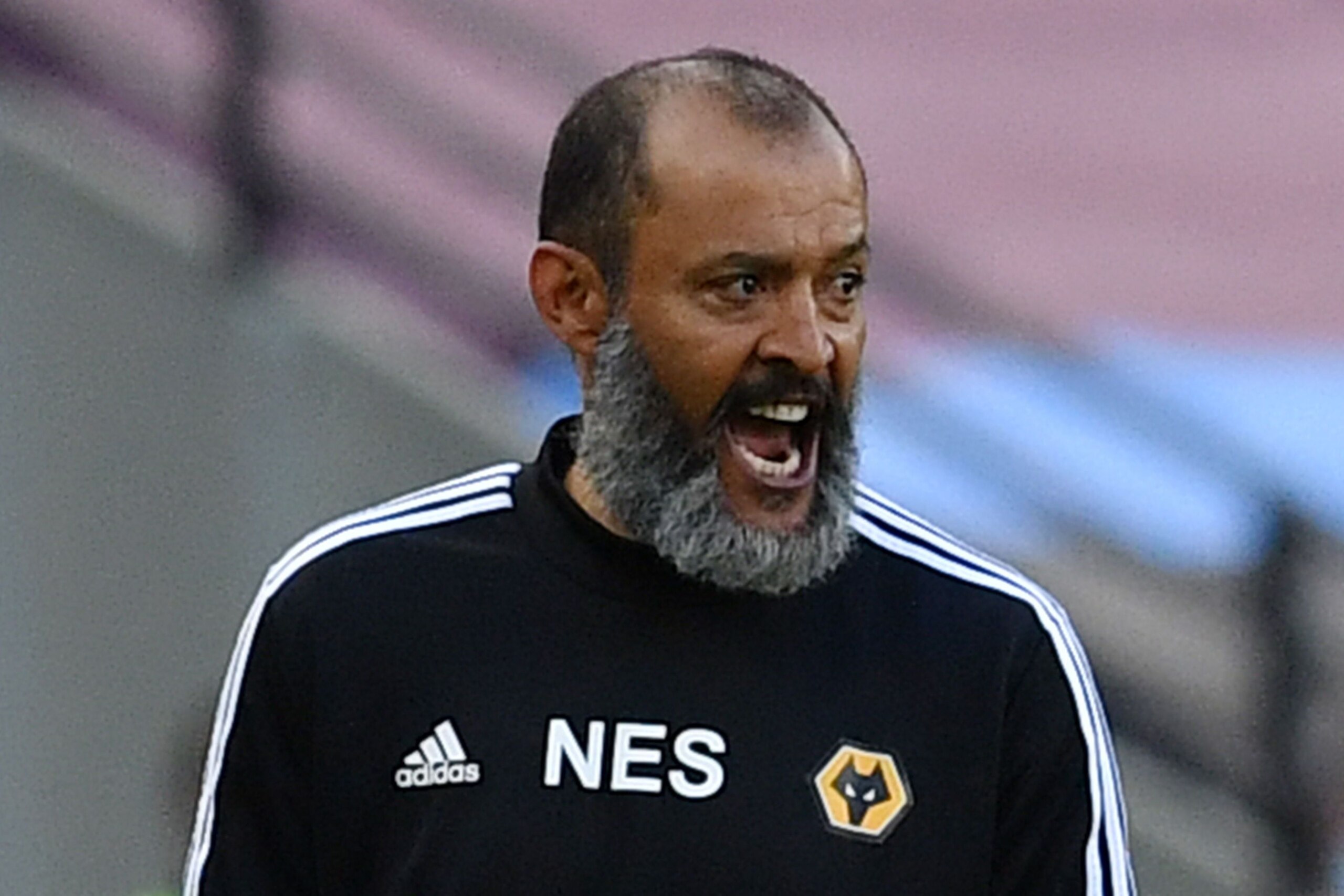 Wolverhampton Wanderers' Portuguese head coach Nuno Espirito Santo shouts from the touchline during the English Premier League football match between West Ham United and Wolverhampton Wanderers at The London Stadium, in east London on June 20, 2020. (Phot