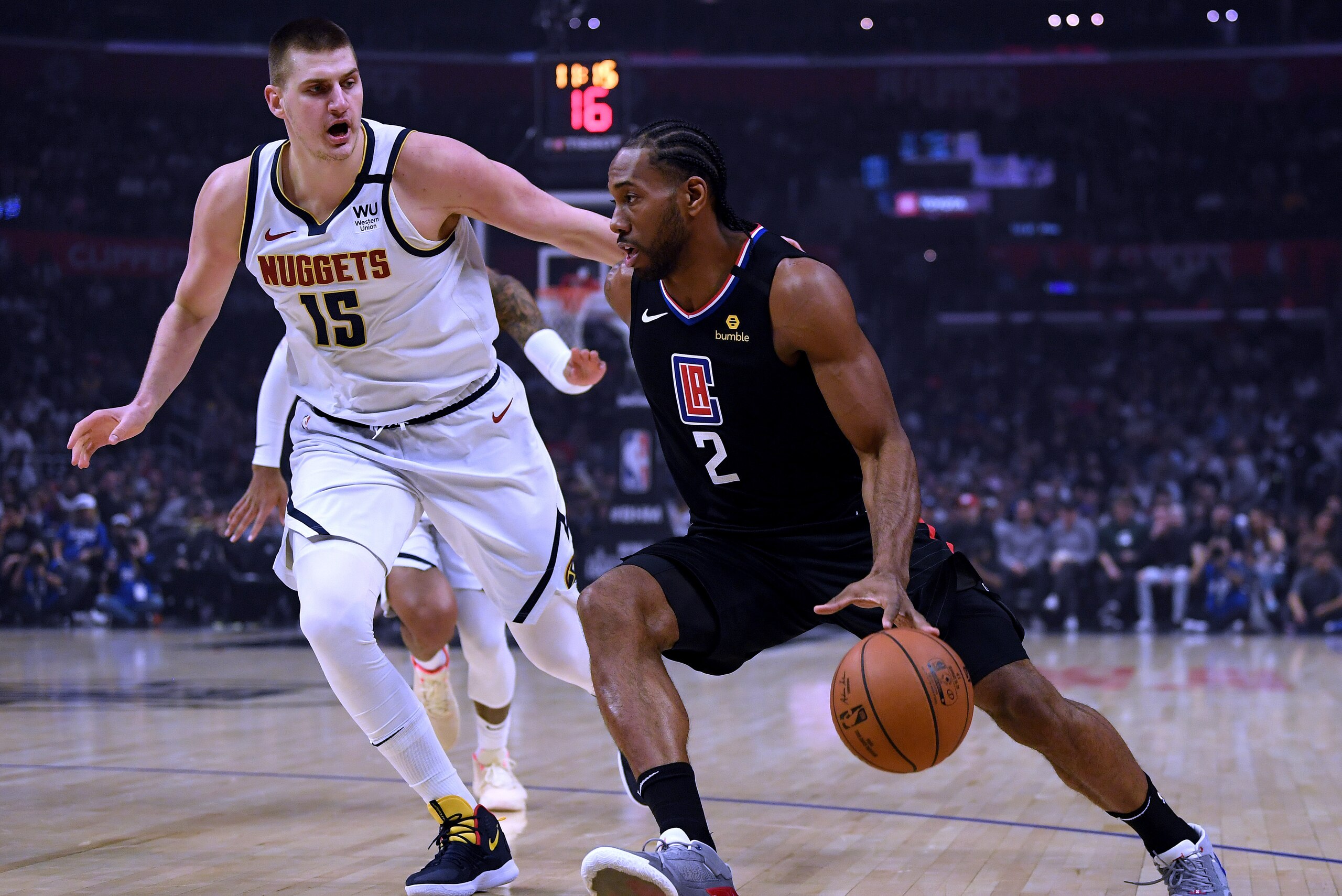 LOS ANGELES, CALIFORNIA - FEBRUARY 28: Kawhi Leonard #2 of the LA Clippers drives to the basket on Nikola Jokic #15 of the Denver Nuggets during the first half at Staples Center on February 28, 2020 in Los Angeles, California. (Photo by Harry How/Getty I LOS ANGELES, CALIFORNIA - FEBRUARY 28: Kawhi Leonard #2 of the LA Clippers drives to the basket on Nikola Jokic #15 of the Denver Nuggets during the first half at Staples Center on February 28, 2020 in Los Angeles, California. (Photo by Harry How/Getty I