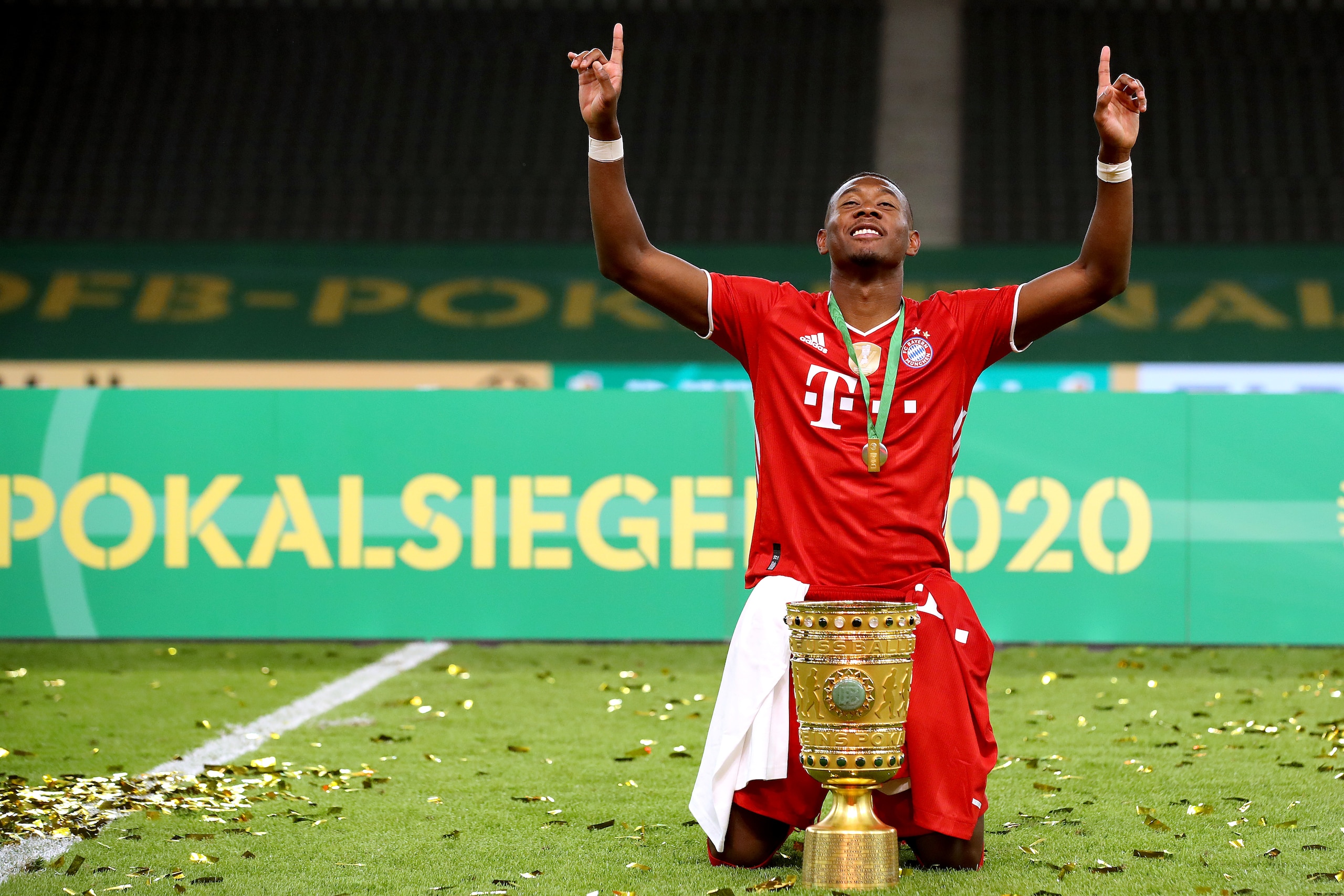 BERLIN, GERMANY - JULY 04:  David Alaba of FC Bayern Muenchen poses with the trophy in celebration after the DFB Cup final match between Bayer 04 Leverkusen and FC Bayern Muenchen at Olympiastadion on July 04, 2020 in Berlin, Germany. (Photo by Alexander 