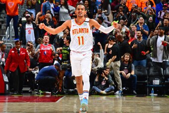 ATLANTA, GA - MARCH 11: Trae Young #11 of the Atlanta Hawks reacts to play on March 11, 2020 at State Farm Arena in Atlanta, Georgia.  NOTE TO USER: User expressly acknowledges and agrees that, by downloading and/or using this Photograph, user is consenti