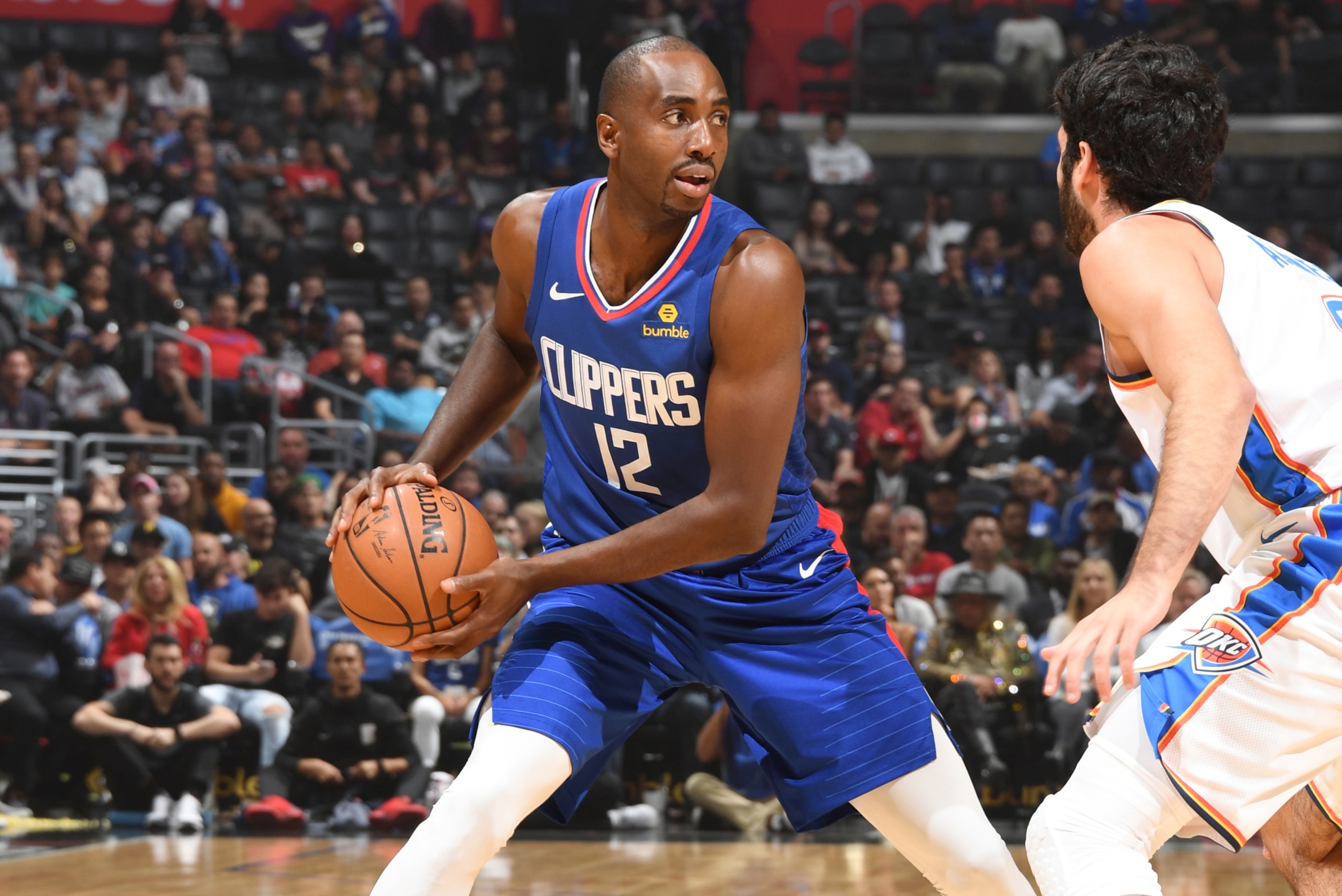 LOS ANGELES, CA - OCTOBER 19: Luc Mbah a Moute #12 of the LA Clippers handles the ball against the Oklahoma City Thunder on October 19, 2018 at STAPLES Center in Los Angeles, California. NOTE TO USER: User expressly acknowledges and agrees that, by downlo