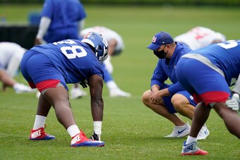 Giants rookie lineman Andrew Thomas gets a close look from Judge at an August practice.