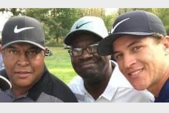 Cam Champ with his grandfather, Mack (center), and father, Jeff.