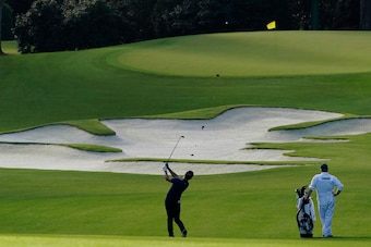 Champ hits toward the 10th green at Augusta National during a practice round this week.