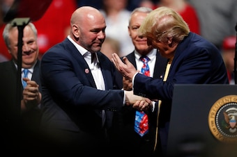 Dana White (left) and Donald Trump shake hands