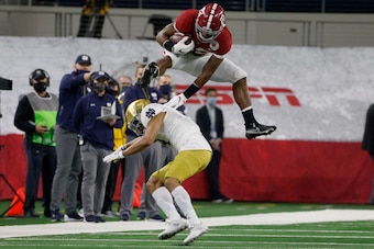 Alabama RB Najee Harris hurdling Notre Dame CB Nick McCloud