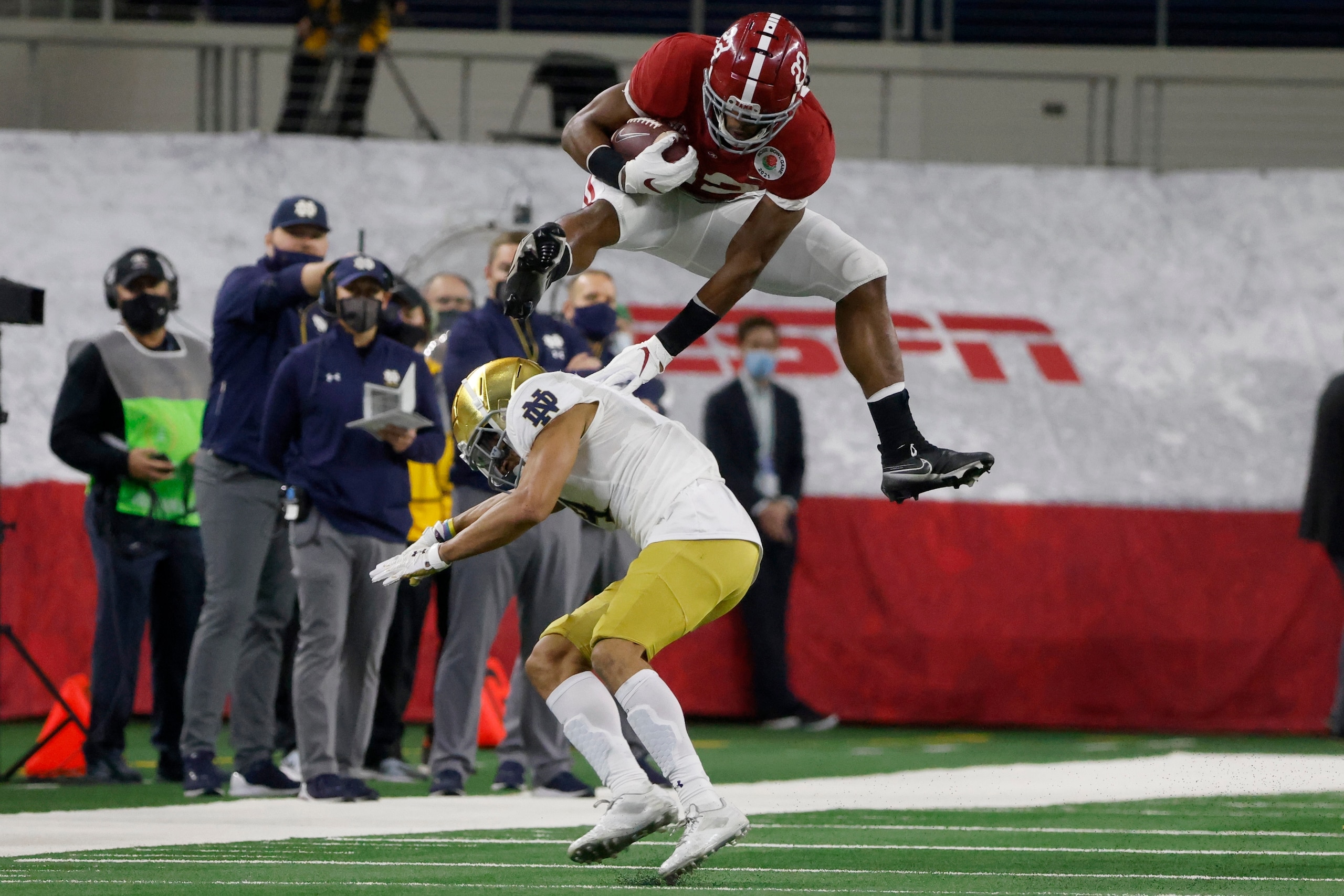 Alabama RB Najee Harris hurdling Notre Dame CB Nick McCloud