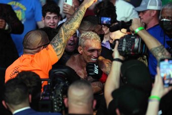 Oliveira (center) in the crowd