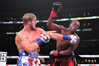 LOS ANGELES, CA - NOVEMBER 09: Logan Paul (red/white/blue shorts) and KSI (black/red shorts) exchange punches their pro debut cruiserweight fight at Staples Center on November 9, 2019 in Los Angeles, California. KSI won by decision. (Photo by Jayne Kamin-