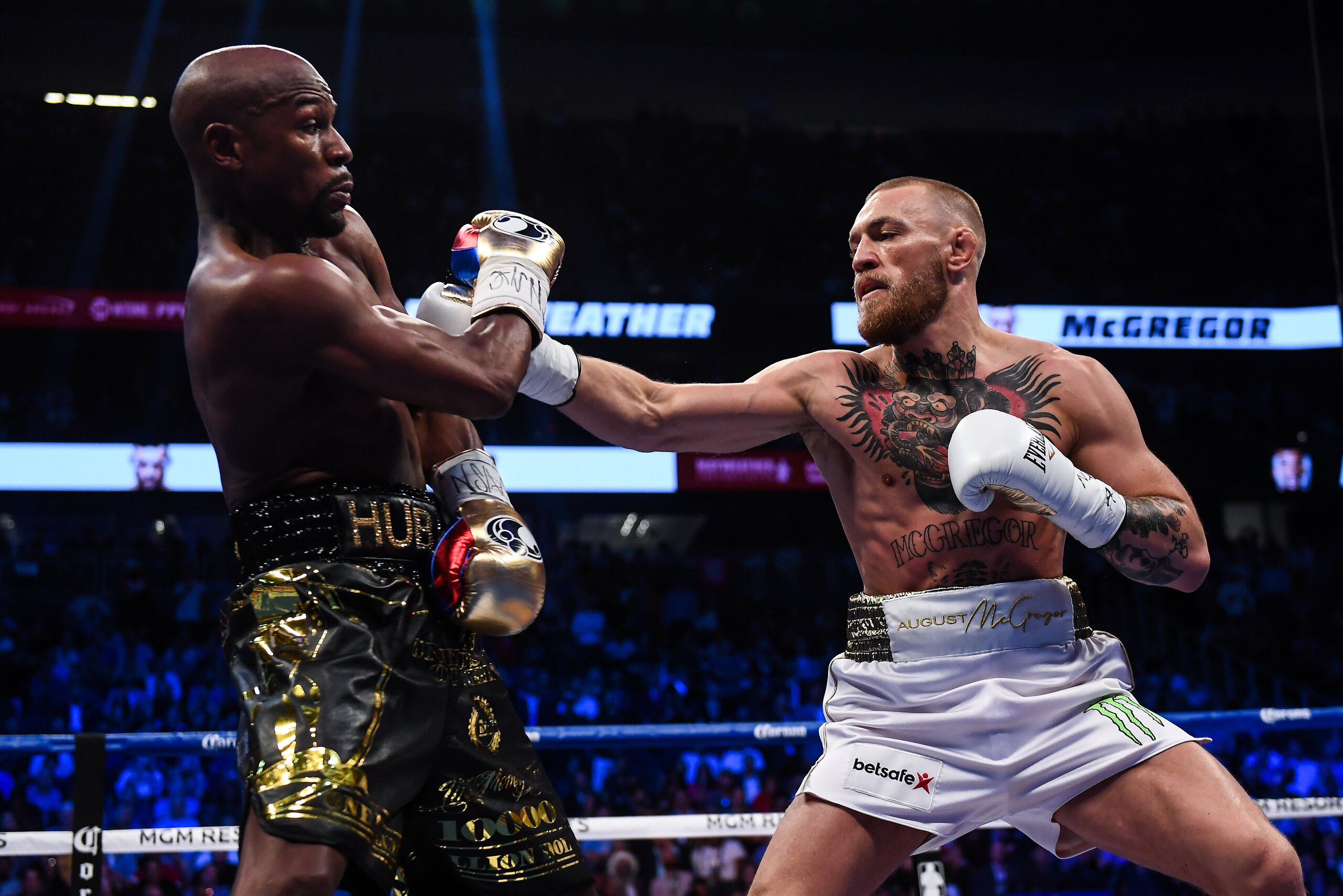 Nevada , United States - 26 August 2017; Conor McGregor, right, and Floyd Mayweather Jr during their super welterweight boxing match at T-Mobile Arena in Las Vegas, USA. (Photo By Stephen McCarthy/Sportsfile via Getty Images)