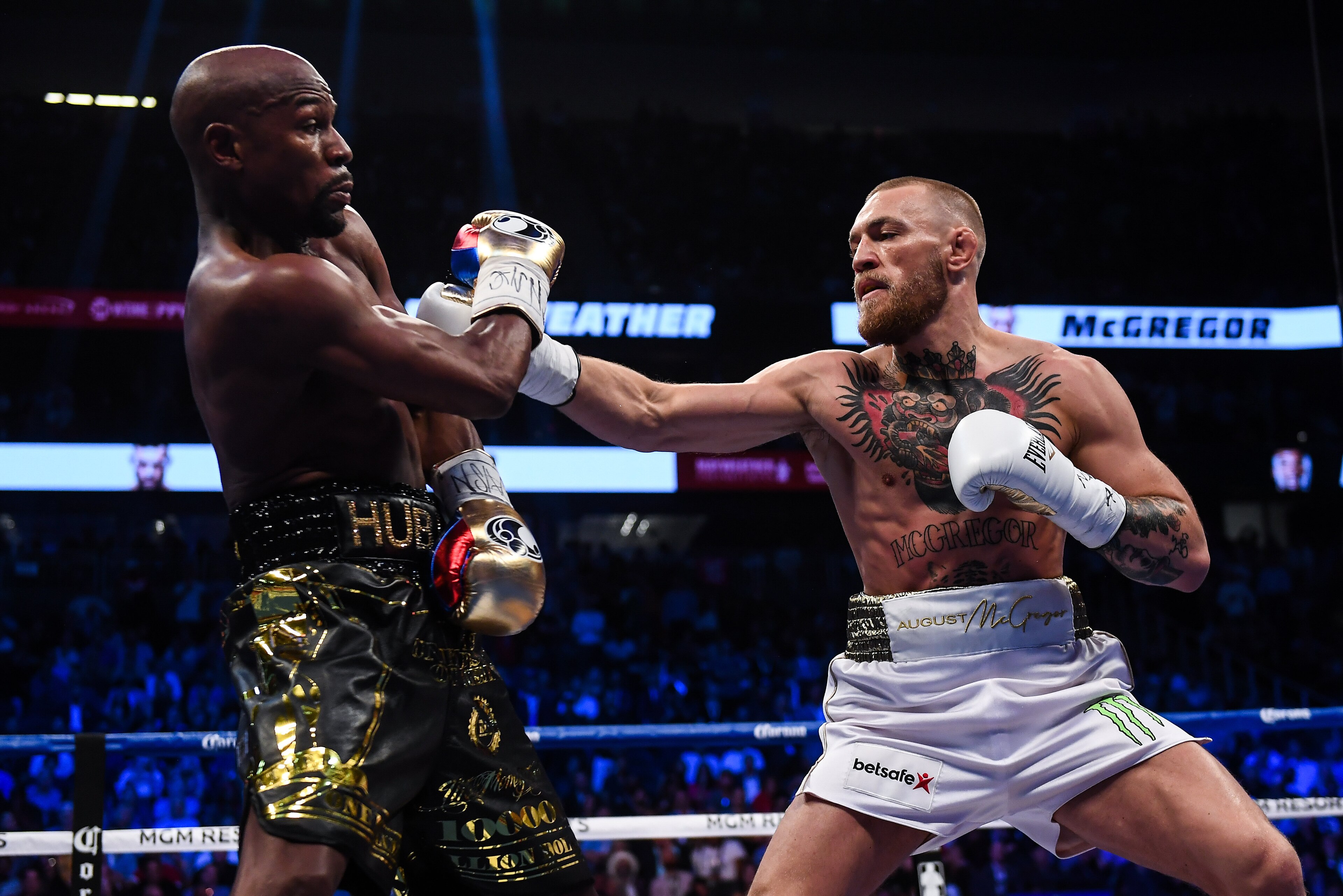 Nevada , United States - 26 August 2017; Conor McGregor, right, and Floyd Mayweather Jr during their super welterweight boxing match at T-Mobile Arena in Las Vegas, USA. (Photo By Stephen McCarthy/Sportsfile via Getty Images)
