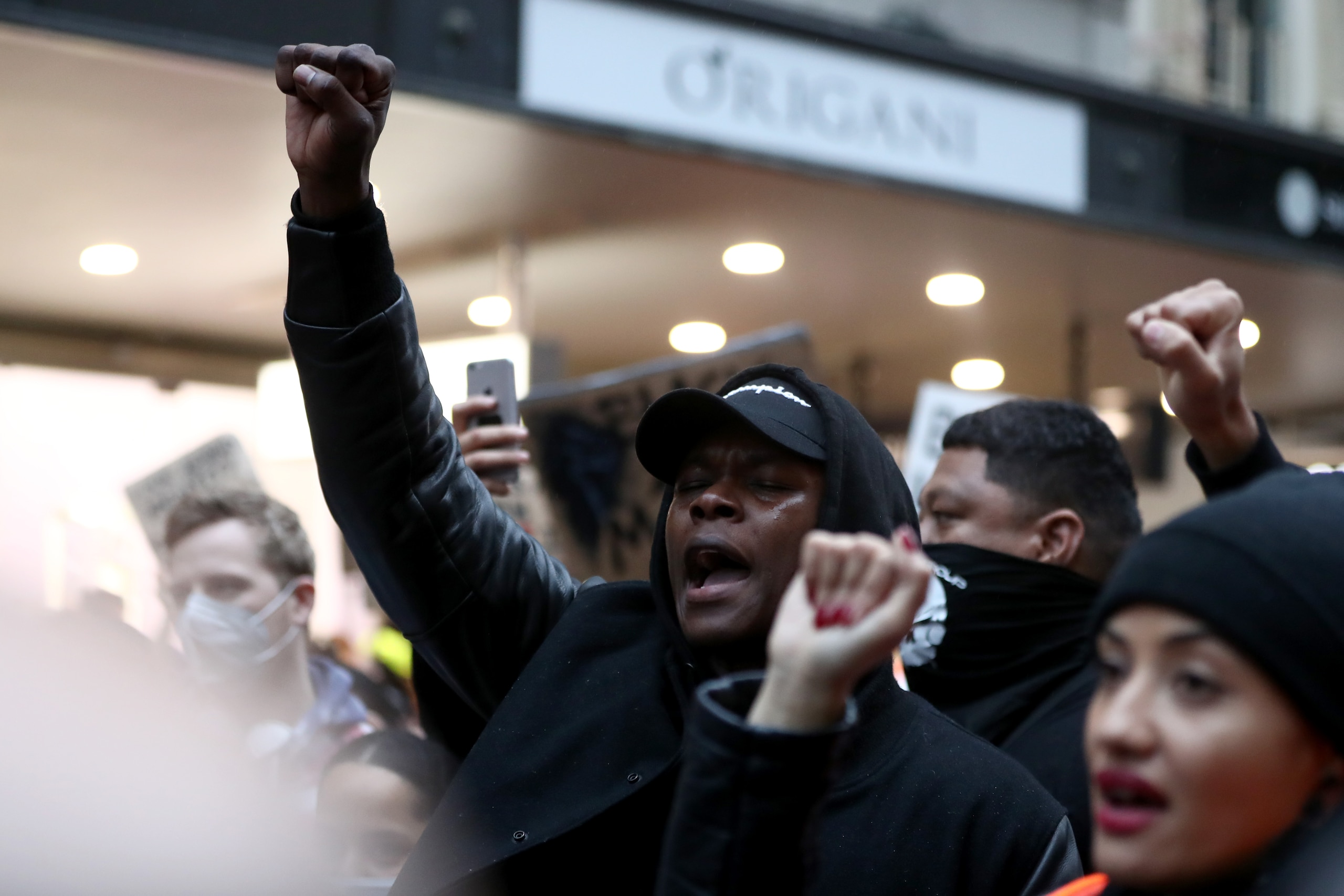 AUCKLAND, NEW ZEALAND - JUNE 01: UFC fighter Israel Adesanya joins in the protest down Queen Street on June 01, 2020 in Auckland, New Zealand. The rally was organised in solidarity with protests across the United States following the killing of an unarmed