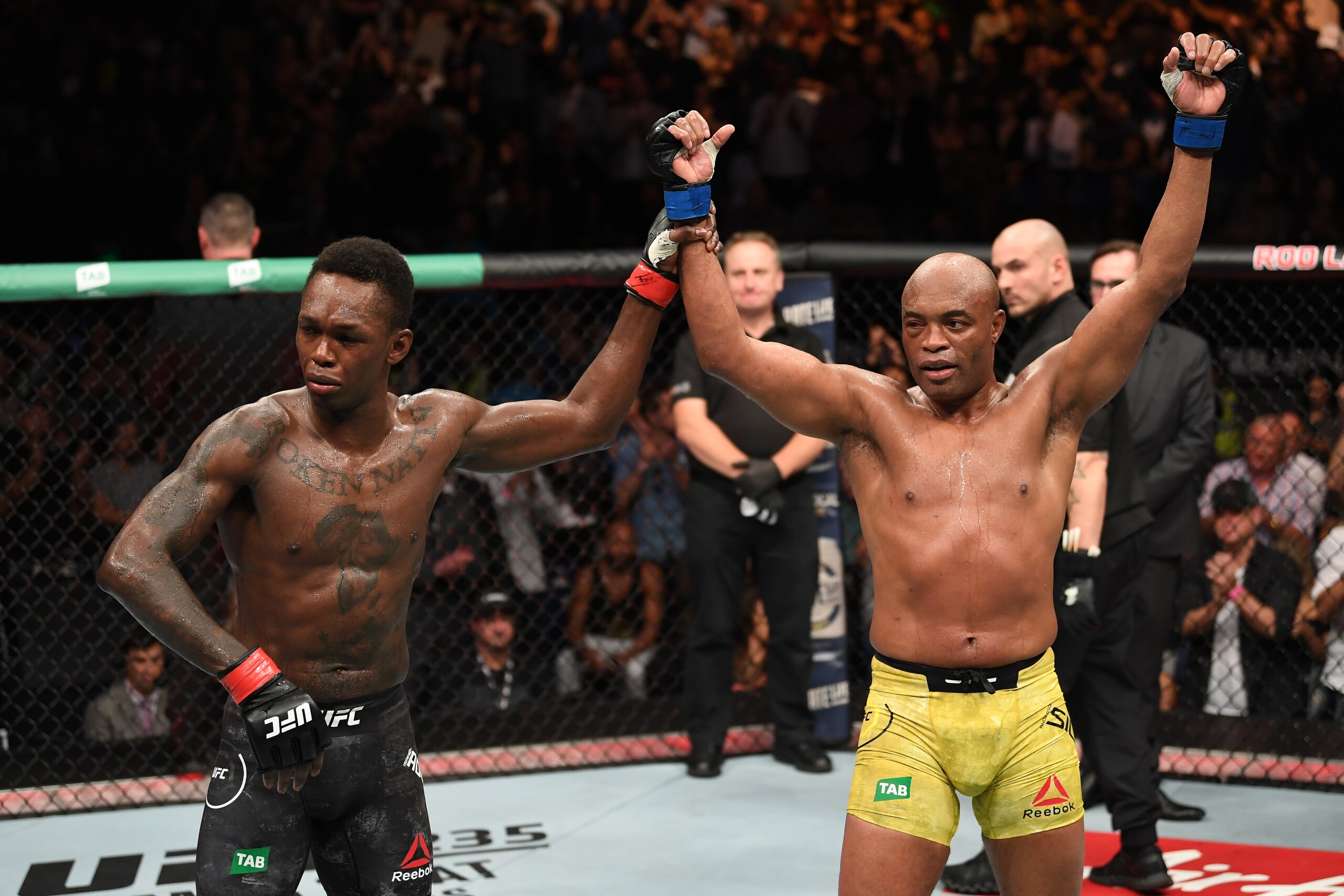 MELBOURNE, AUSTRALIA - FEBRUARY 10:  (R-L) Anderson Silva of Brazil and Israel Adesanya of New Zealand react after the conclusion of their middleweight bout during the UFC 234 at Rod Laver Arena on February 10, 2019 in the Melbourne, Australia. (Photo by 