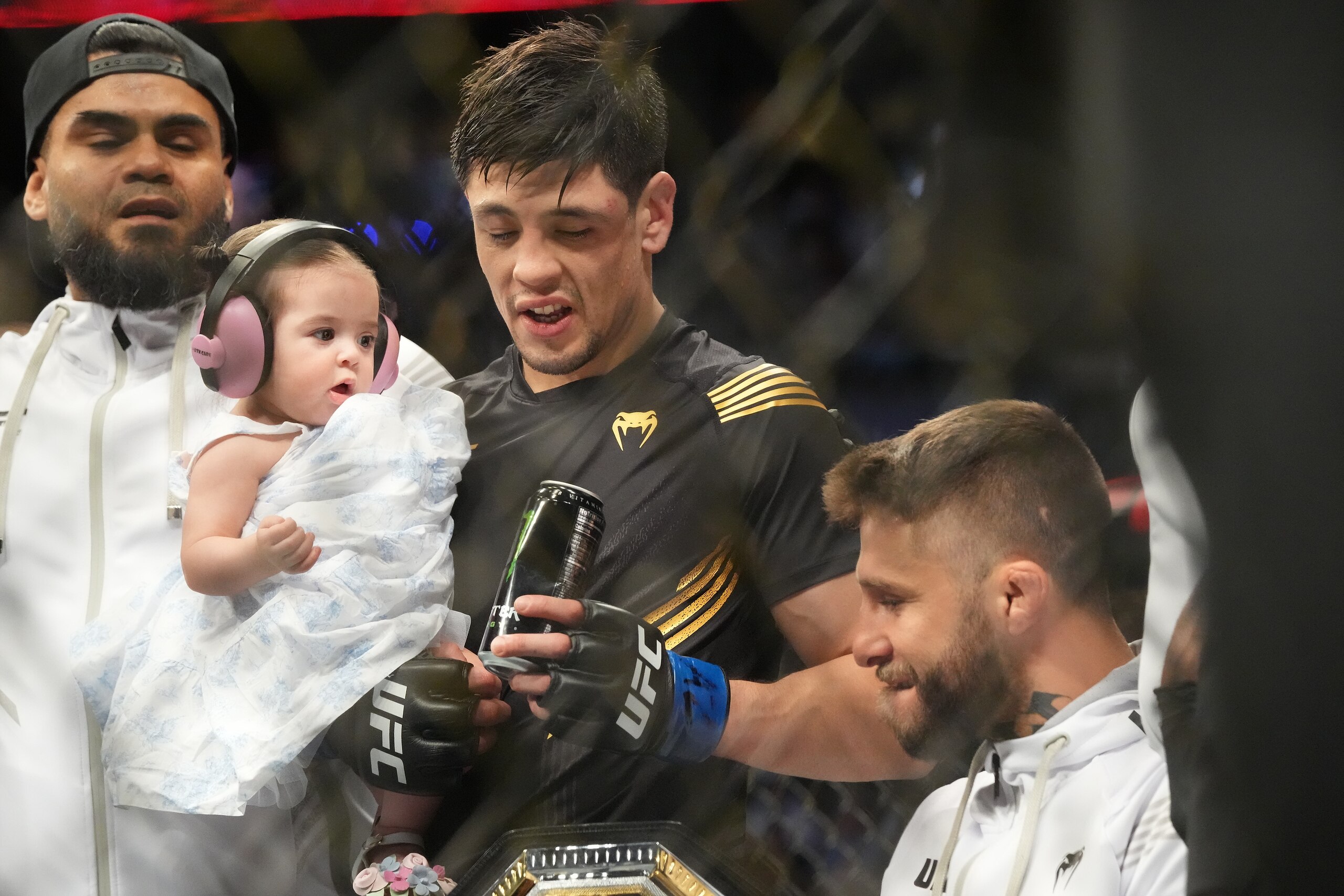 GLENDALE, AZ - JUNE 12: Brandon Moreno (blue gloves) celebrates the victory during UFC 263 on June 12, 2021, at Gila River Arena in Glendale, AZ. (Photo by Louis Grasse/PxImages/Icon Sportswire via Getty Images)
