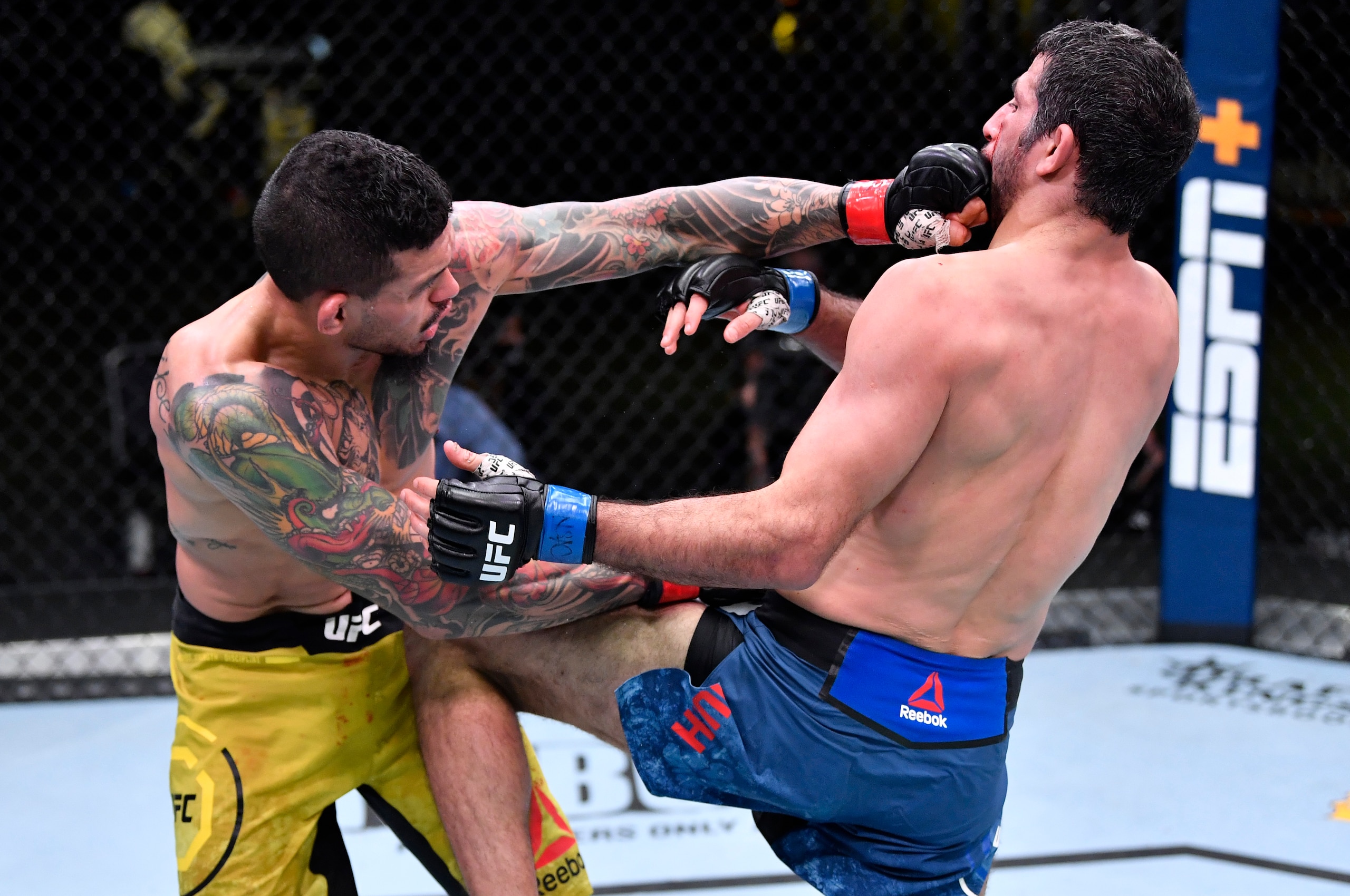 LAS VEGAS, NEVADA - FEBRUARY 06: (L-R) Diego Ferreira of Brazil punches Beneil Dariush of Iran in their lightweight fight during the UFC Fight Night event at UFC APEX on February 06, 2021 in Las Vegas, Nevada. (Photo by Chris Unger/Zuffa LLC)