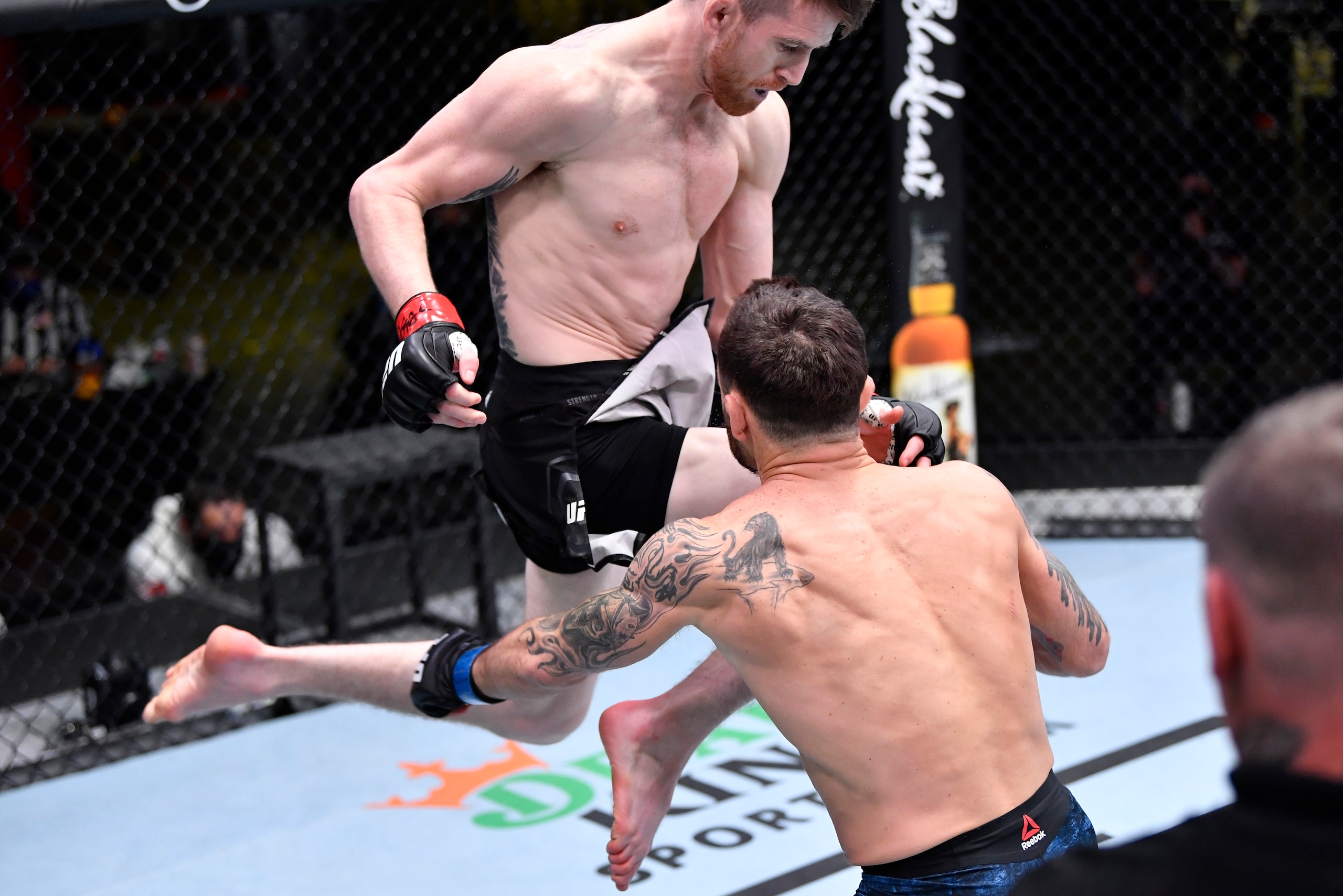 LAS VEGAS, NEVADA - FEBRUARY 06: In this handout image provided by UFC, Cory Sandhagen lands a flying knee to knock out Frankie Edgar in their bantamweight fight during the UFC Fight Night event at UFC APEX on February 06, 2021 in Las Vegas, Nevada. (Phot