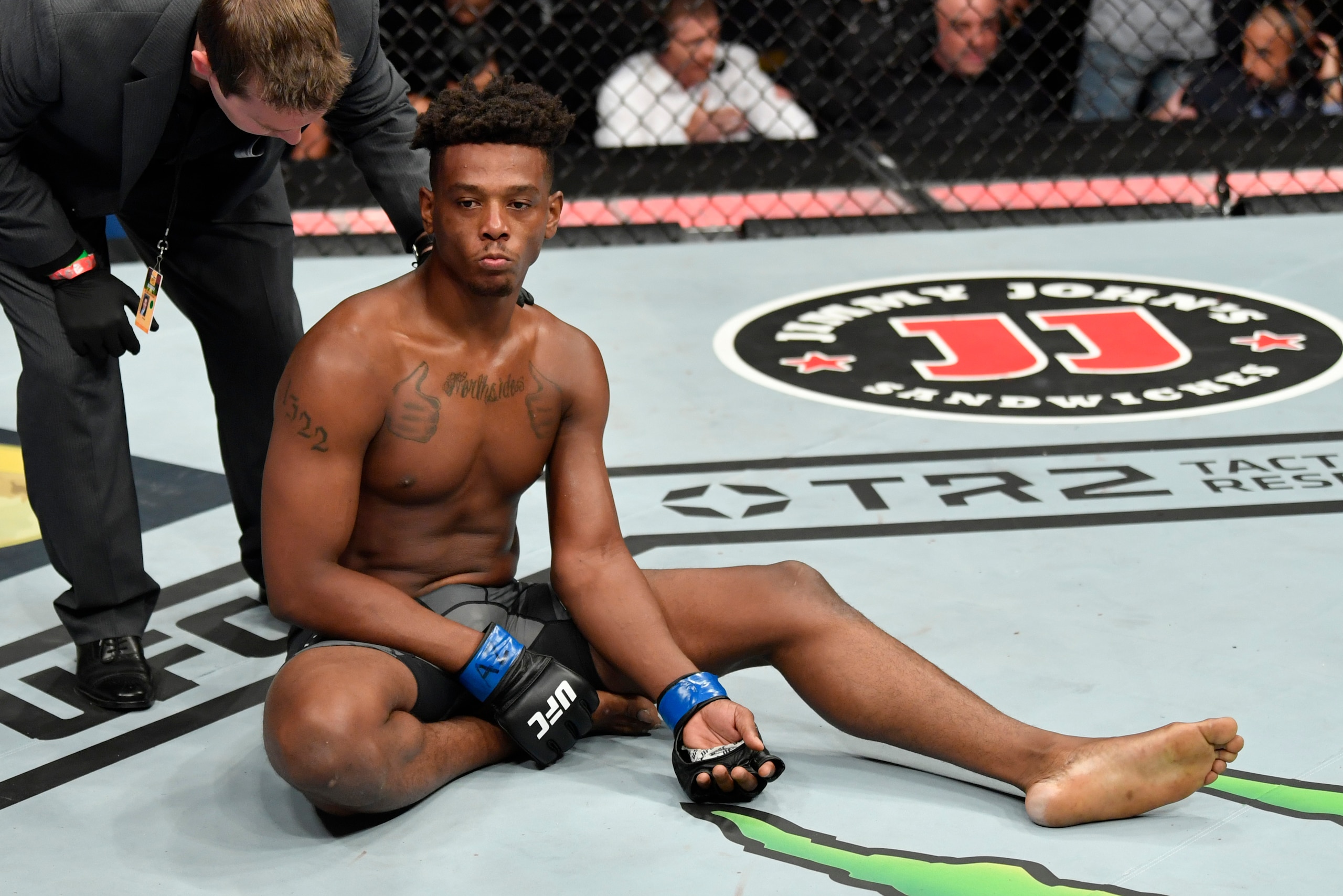 GLENDALE, ARIZONA - JUNE 12: Jamahal Hill reacts after suffering an arm injury against Paul Craig of Scotland in their light heavyweight fight during the UFC 263 event at Gila River Arena on June 12, 2021 in Glendale, Arizona. (Photo by Jeff Bottari/Zuffa