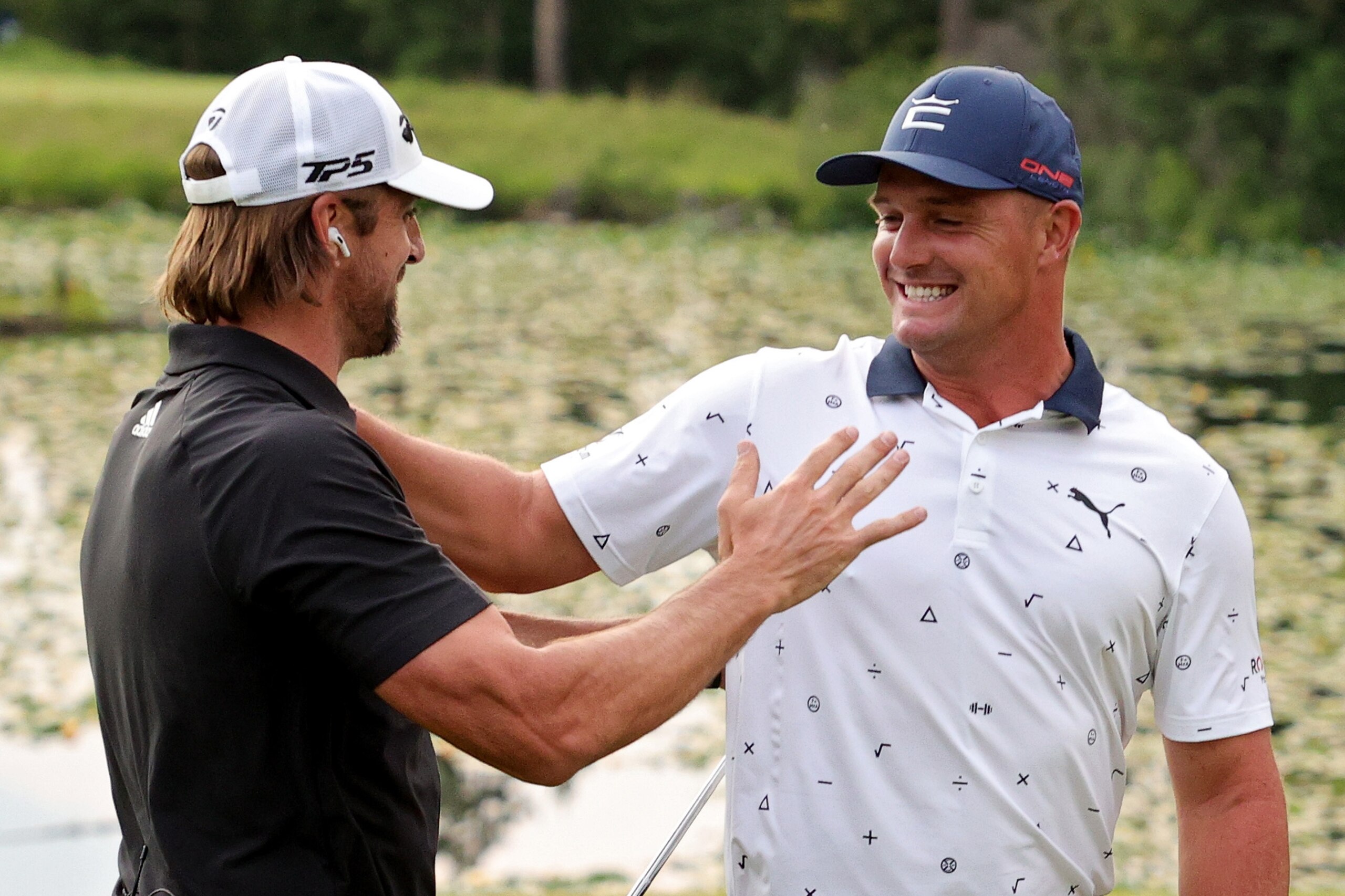 BIG SKY, MONTANA - JULY 06: Aaron Rodgers (L) and Bryson DeChambeau celebrate after winning Capital One's The Match at The Reserve at Moonlight Basin on July 06, 2021 in Big Sky, Montana. (Photo by Stacy Revere/Getty Images for The Match)